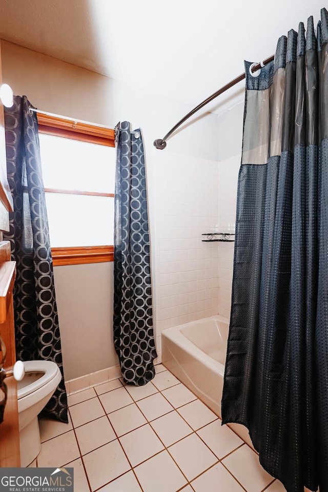 full bath with tile patterned flooring, shower / tub combo, and toilet