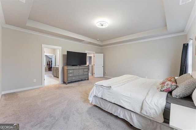 bedroom featuring carpet floors, a raised ceiling, crown molding, and baseboards