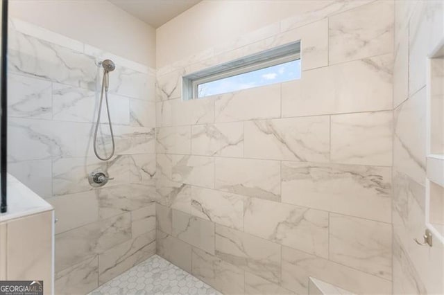 bathroom featuring a tile shower