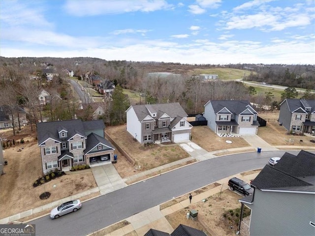 birds eye view of property with a residential view