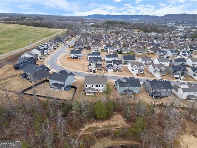 birds eye view of property featuring a mountain view and a residential view