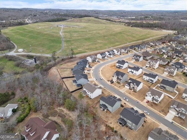 birds eye view of property with a residential view