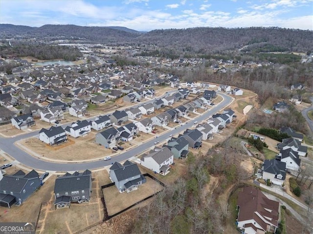 birds eye view of property with a residential view