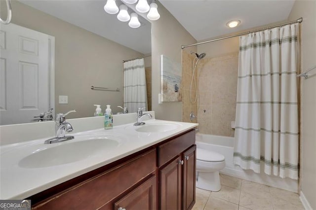 full bathroom with double vanity, a sink, shower / bath combo with shower curtain, and tile patterned floors