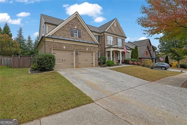 view of front of home with concrete driveway, brick siding, a front lawn, and fence