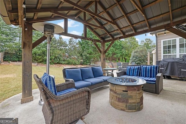 view of patio featuring a gazebo, area for grilling, and an outdoor living space with a fire pit