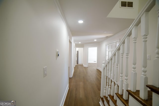 hall featuring recessed lighting, visible vents, wood finished floors, and ornamental molding