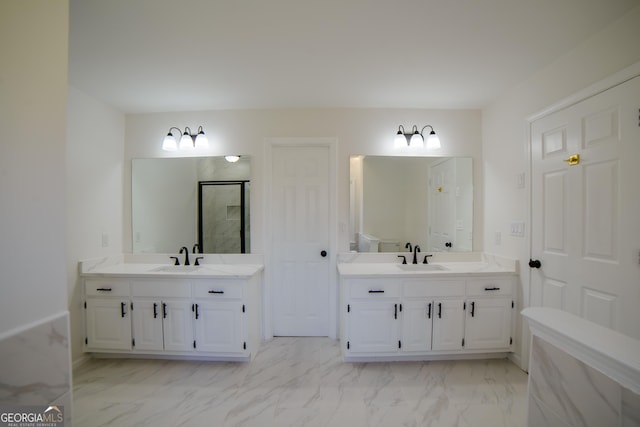 full bathroom featuring a sink, two vanities, and marble finish floor