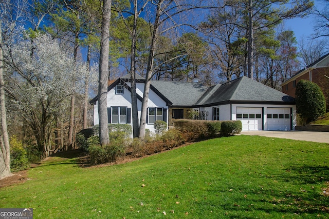ranch-style home with stucco siding, a front lawn, roof with shingles, concrete driveway, and a garage