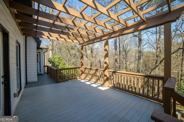 wooden deck featuring a pergola
