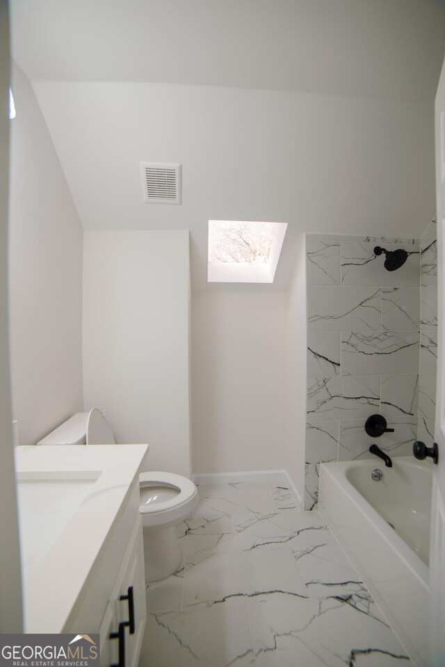 full bathroom with vanity, visible vents, a skylight, toilet, and marble finish floor