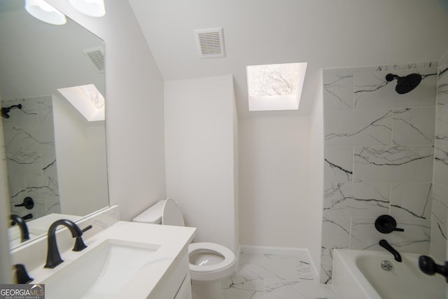 bathroom with vanity, visible vents, a skylight, toilet, and marble finish floor