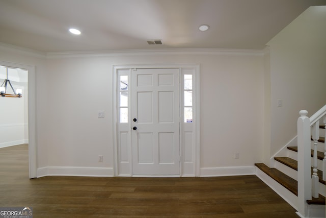 entryway with visible vents, ornamental molding, stairway, baseboards, and dark wood-style flooring