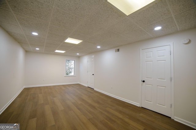 spare room featuring recessed lighting, visible vents, baseboards, and dark wood-style floors