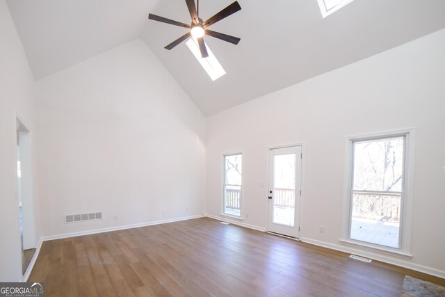 unfurnished dining area featuring a chandelier, baseboards, ornamental molding, a tray ceiling, and dark wood finished floors