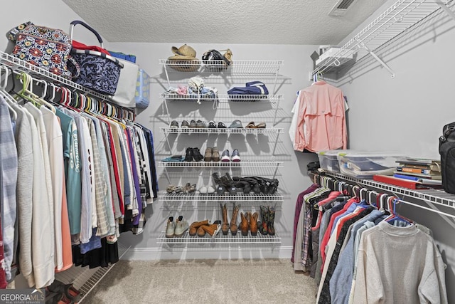 walk in closet with visible vents