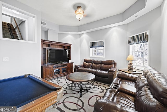 carpeted living room with visible vents and billiards