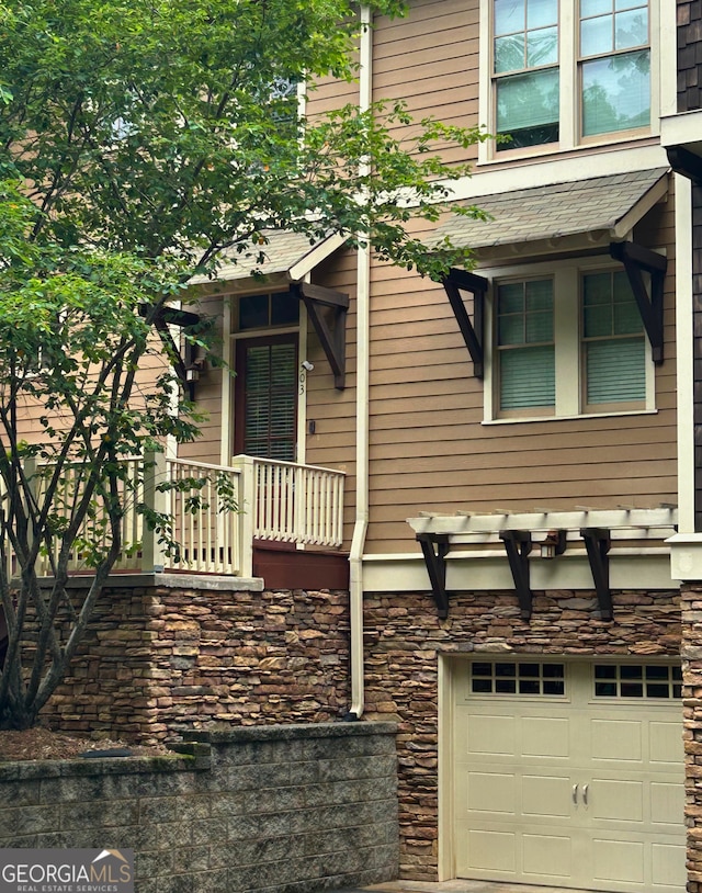 310 Research Dr Unit 303, Athens, GA 30605 - view of property exterior featuring a garage and stone siding