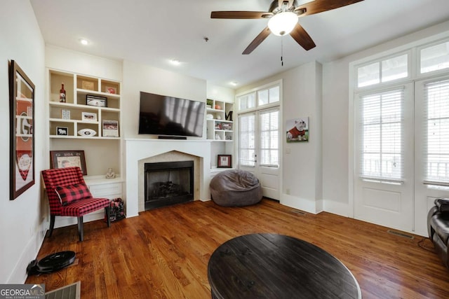 310 Research Dr Unit 303, Athens, GA 30605 - living room with a fireplace, wood finished floors, baseboards, and a ceiling fan