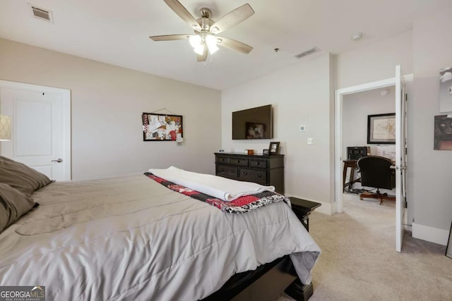 bedroom featuring light carpet, visible vents, and baseboards