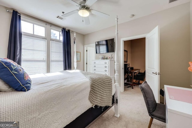 bedroom with carpet, visible vents, and a ceiling fan