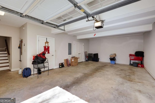 garage with electric panel and a garage door opener