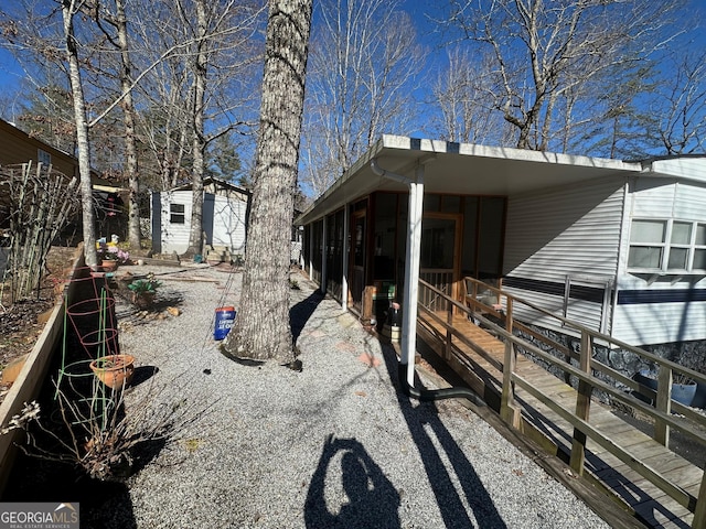 view of property exterior with an outdoor structure