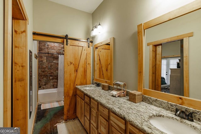 bathroom with double vanity, walk in shower, a sink, and a bathing tub