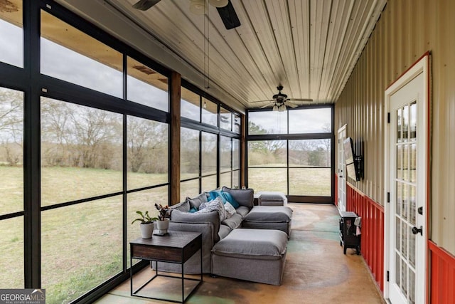 sunroom featuring ceiling fan