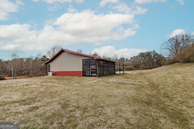 exterior space featuring an outbuilding and a yard