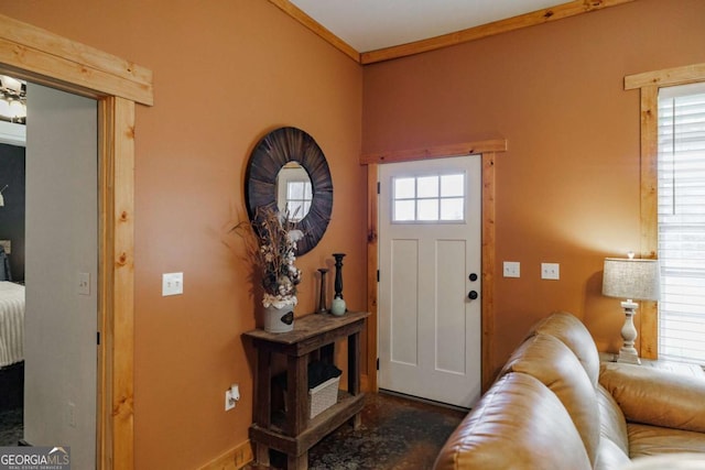 entryway featuring ornamental molding