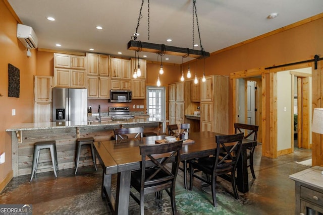 dining space with an AC wall unit, a barn door, recessed lighting, and finished concrete floors