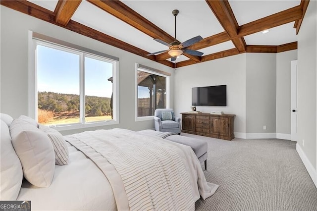 carpeted bedroom featuring coffered ceiling, beamed ceiling, baseboards, and ceiling fan