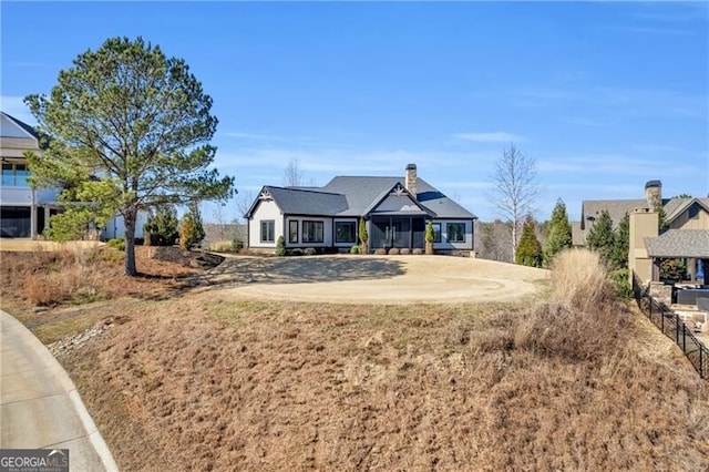 view of front of property with a chimney