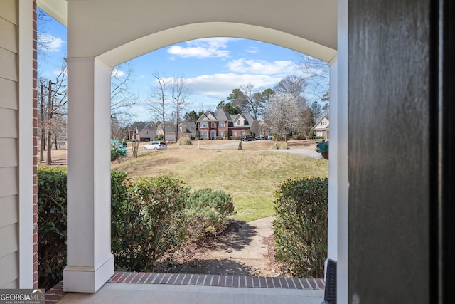 view of yard featuring a residential view