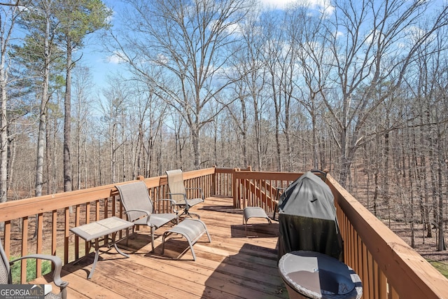 wooden deck featuring a wooded view