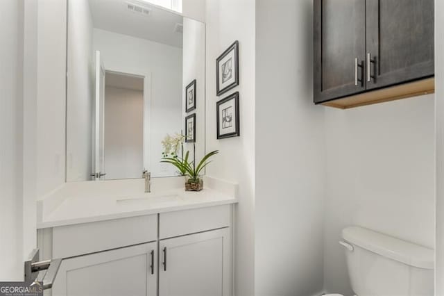 241 Maynard Ter SE Unit 17, Atlanta, GA 30316 - bathroom with toilet, vanity, and visible vents