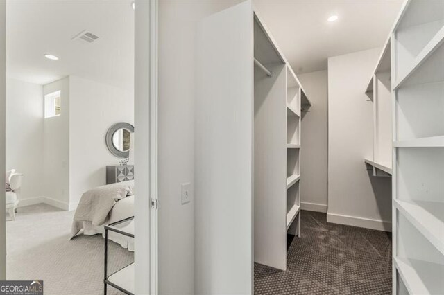 241 Maynard Ter SE Unit 17, Atlanta, GA 30316 - walk in closet with dark colored carpet and visible vents