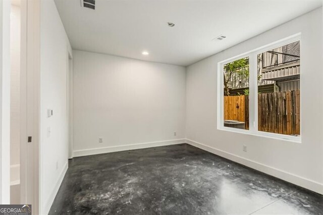 241 Maynard Ter SE Unit 17, Atlanta, GA 30316 - empty room with recessed lighting, visible vents, concrete floors, and baseboards