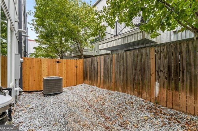 241 Maynard Ter SE Unit 17, Atlanta, GA 30316 - view of yard featuring fence and central AC unit
