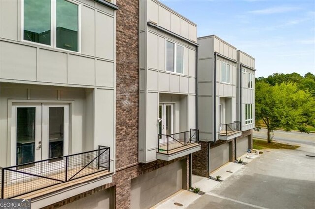 241 Maynard Ter SE Unit 17, Atlanta, GA 30316 - view of building exterior featuring an attached garage