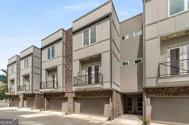 241 Maynard Ter SE Unit 17, Atlanta, GA 30316 - view of property featuring an attached garage