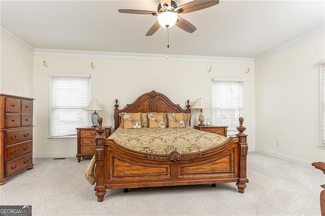 bedroom featuring multiple windows, baseboards, crown molding, and light colored carpet