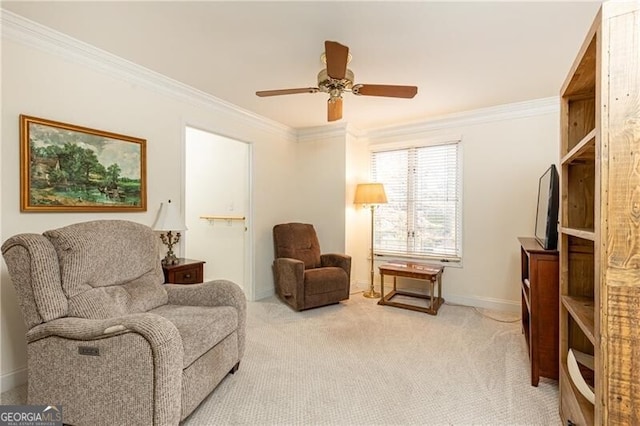 living area with light carpet, ceiling fan, baseboards, and crown molding