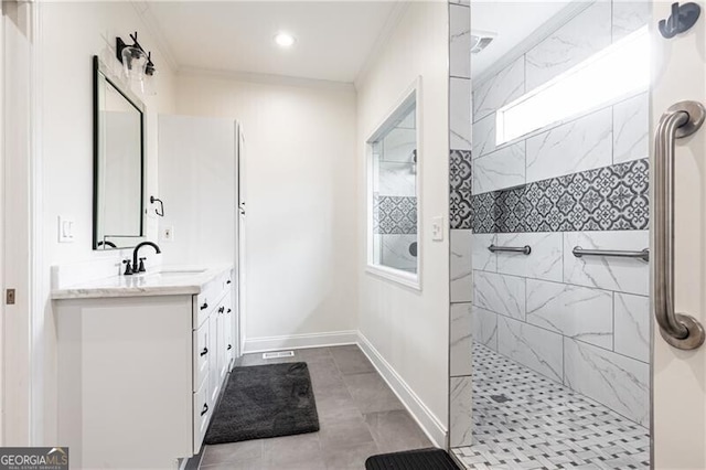 bathroom with vanity, baseboards, and walk in shower