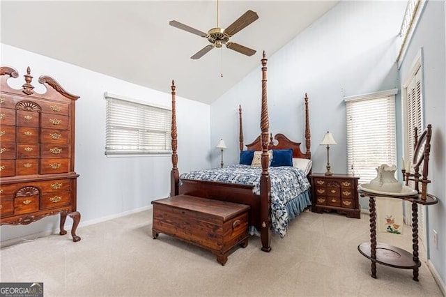 bedroom with a ceiling fan, carpet flooring, baseboards, and multiple windows