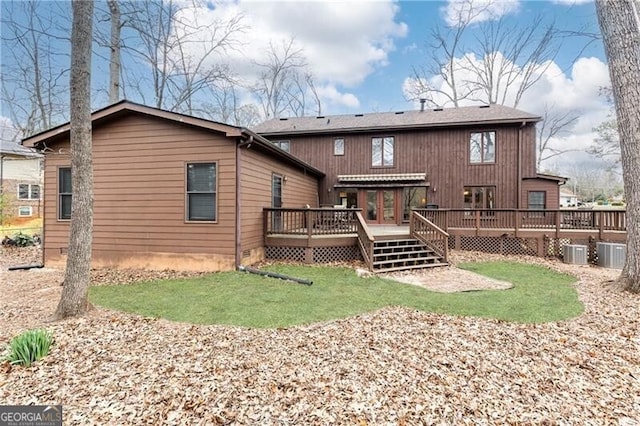 rear view of property featuring crawl space, central AC unit, a lawn, and a wooden deck