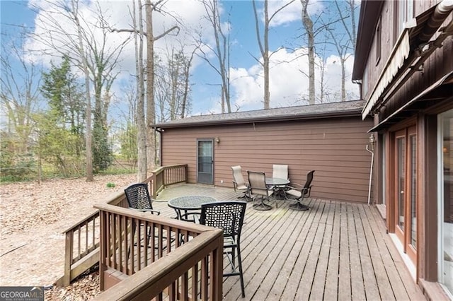 deck featuring outdoor dining area