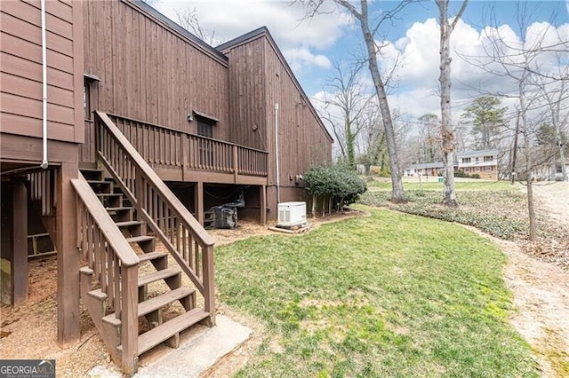 view of yard with stairway and a wooden deck