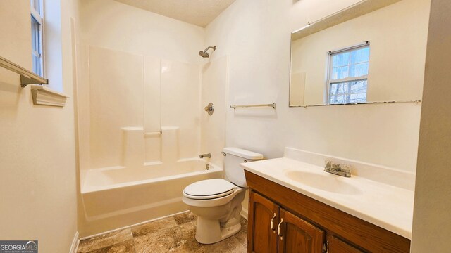 full bathroom featuring shower / bath combination, vanity, and toilet